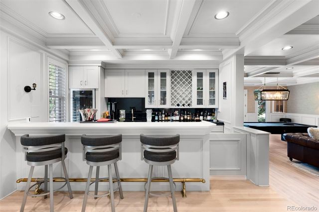 a kitchen with stainless steel appliances granite countertop a stove and white cabinets