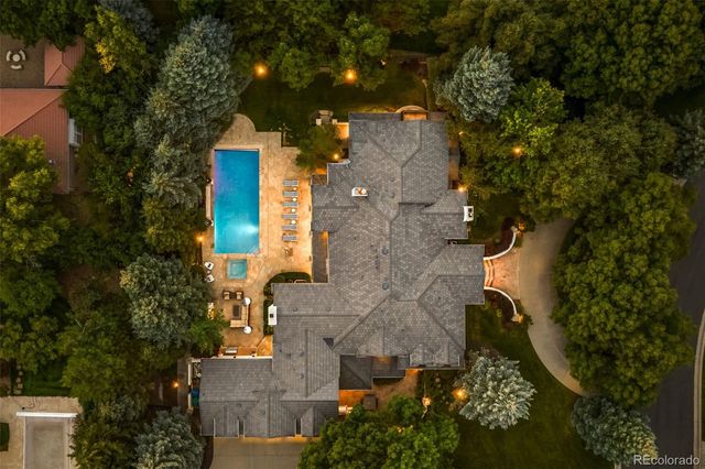 an aerial view of a house with a yard and garden