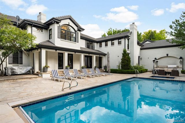 a view of swimming pool with chairs