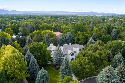 a view of a lush green hillside and houses
