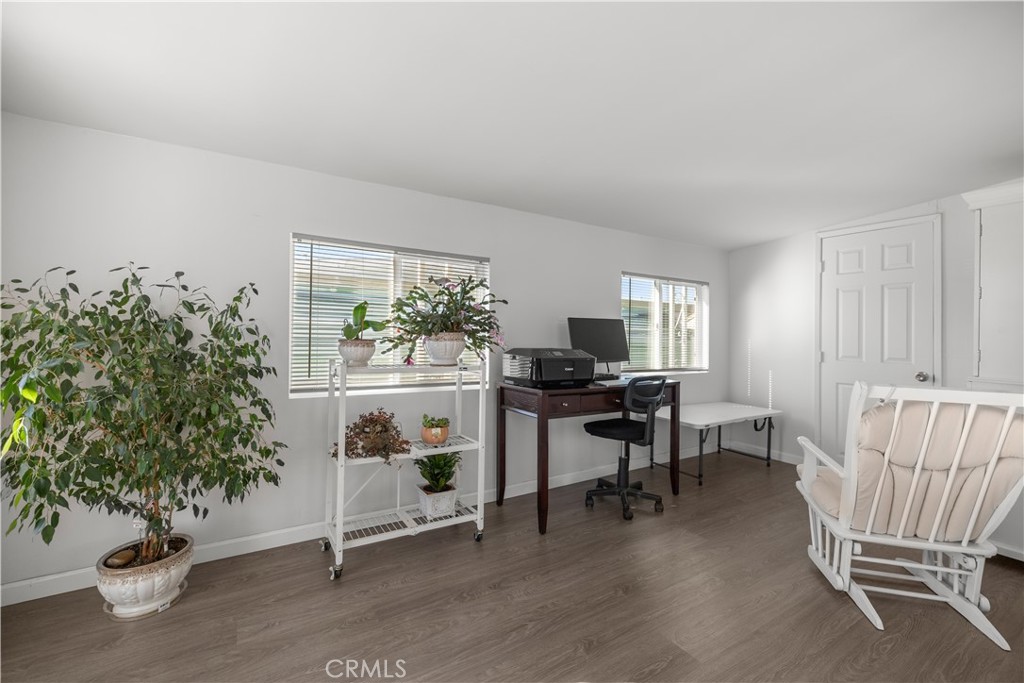 27150 Shadel Road, Unit 122 Menifee, CA 92586 - Photo 5 of 26 a view of a livingroom with furniture and a potted plant