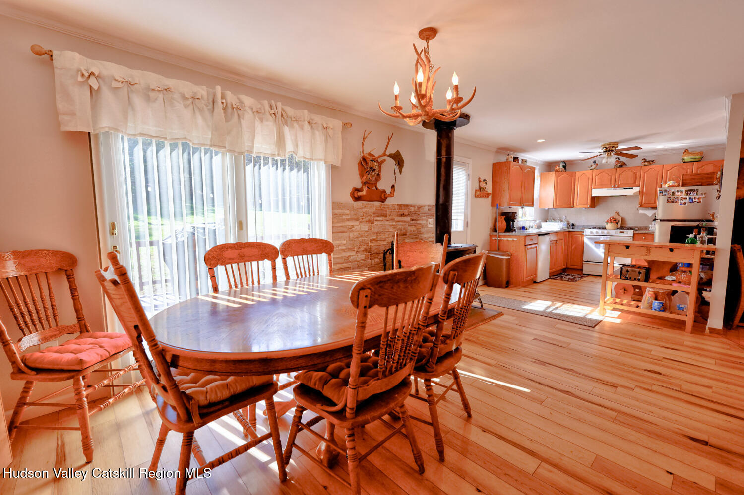 626 Bross Street Cairo, NY 12413 - Photo 19 of 78 a dining room with furniture a chandelier and wooden floor