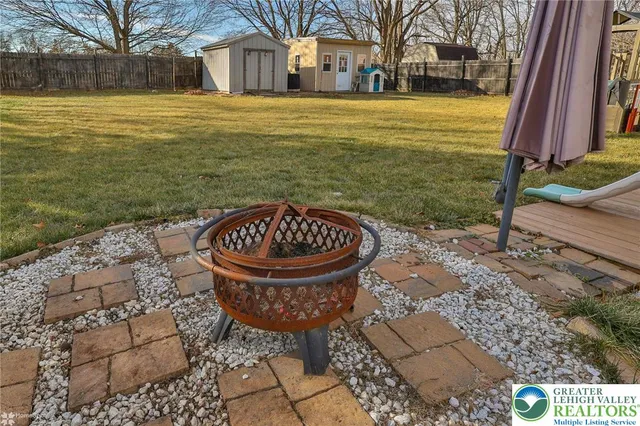 a view of a house with a yard balcony and sitting area
