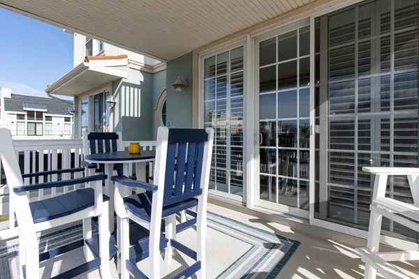 a view of a chairs and table in the patio