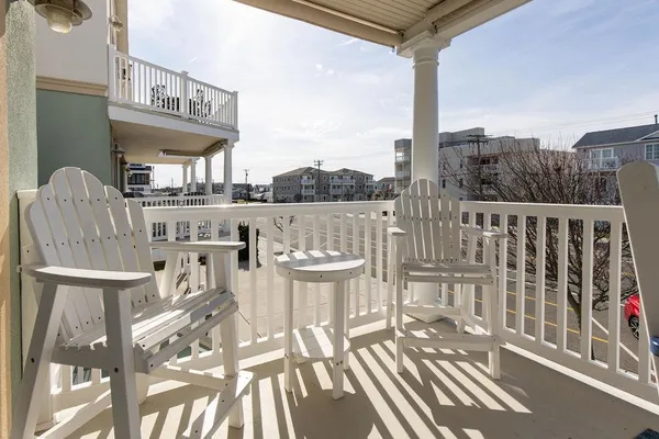 a view of a balcony with furniture