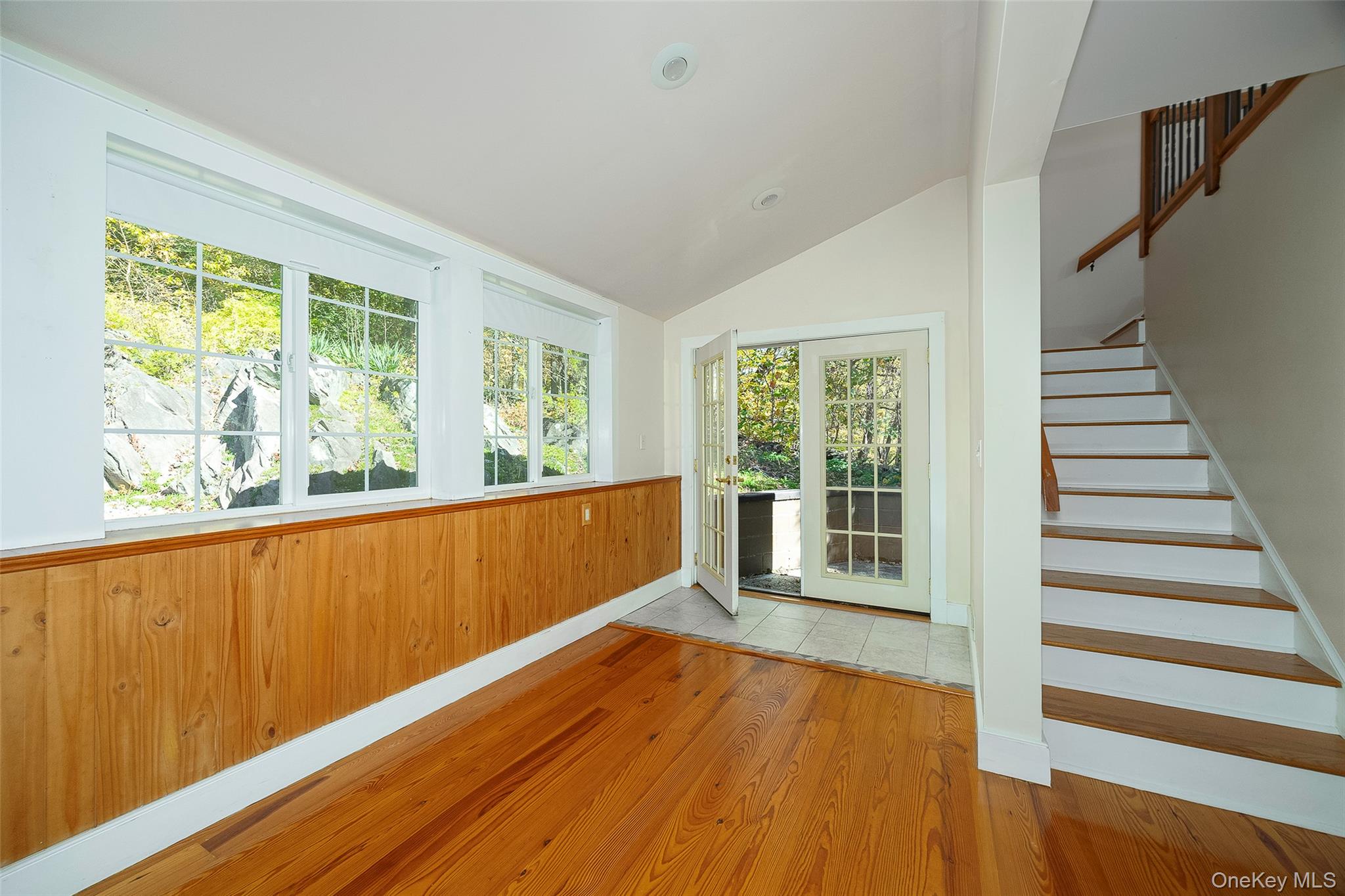 2 Haggerty Hill Road Rhinebeck, NY 12572 - Photo 11 of 47 Unfurnished sunroom with wood finished floors, vaulted ceiling, recessed lighting, and wood walls