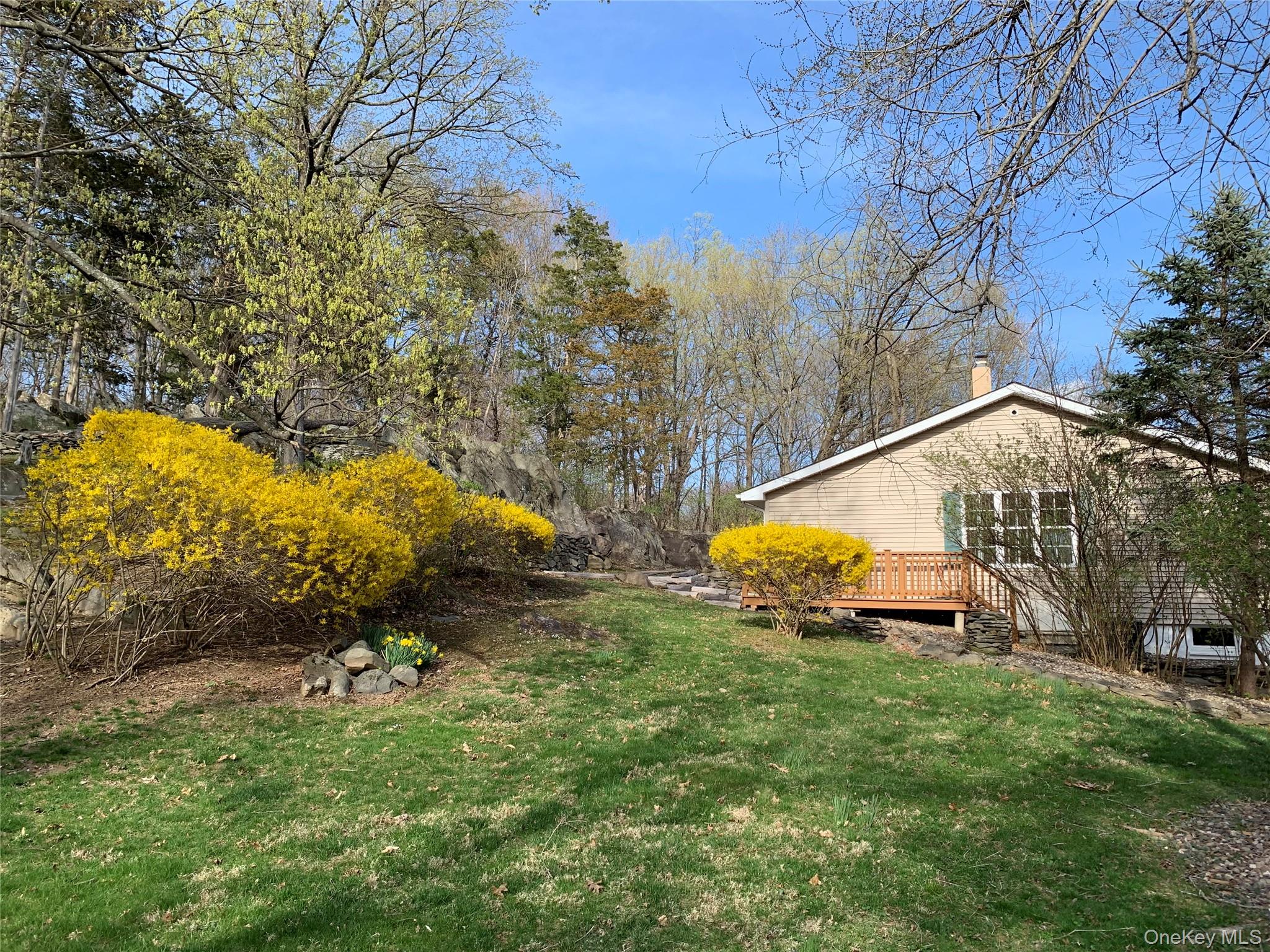 2 Haggerty Hill Road Rhinebeck, NY 12572 - Photo 38 of 47 View of green lawn featuring a wooden deck and view of wooded area