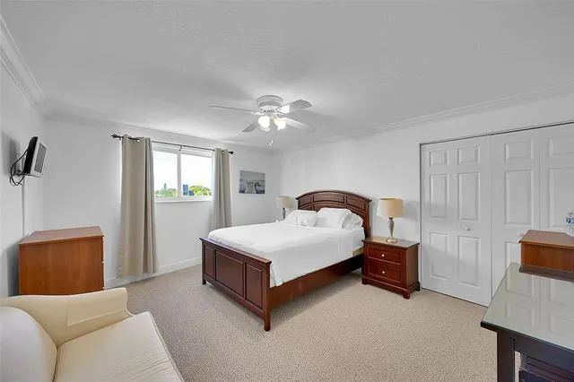 a spacious bedroom with a bed and a couch