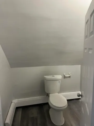 a bathroom with a shower and a bath tub