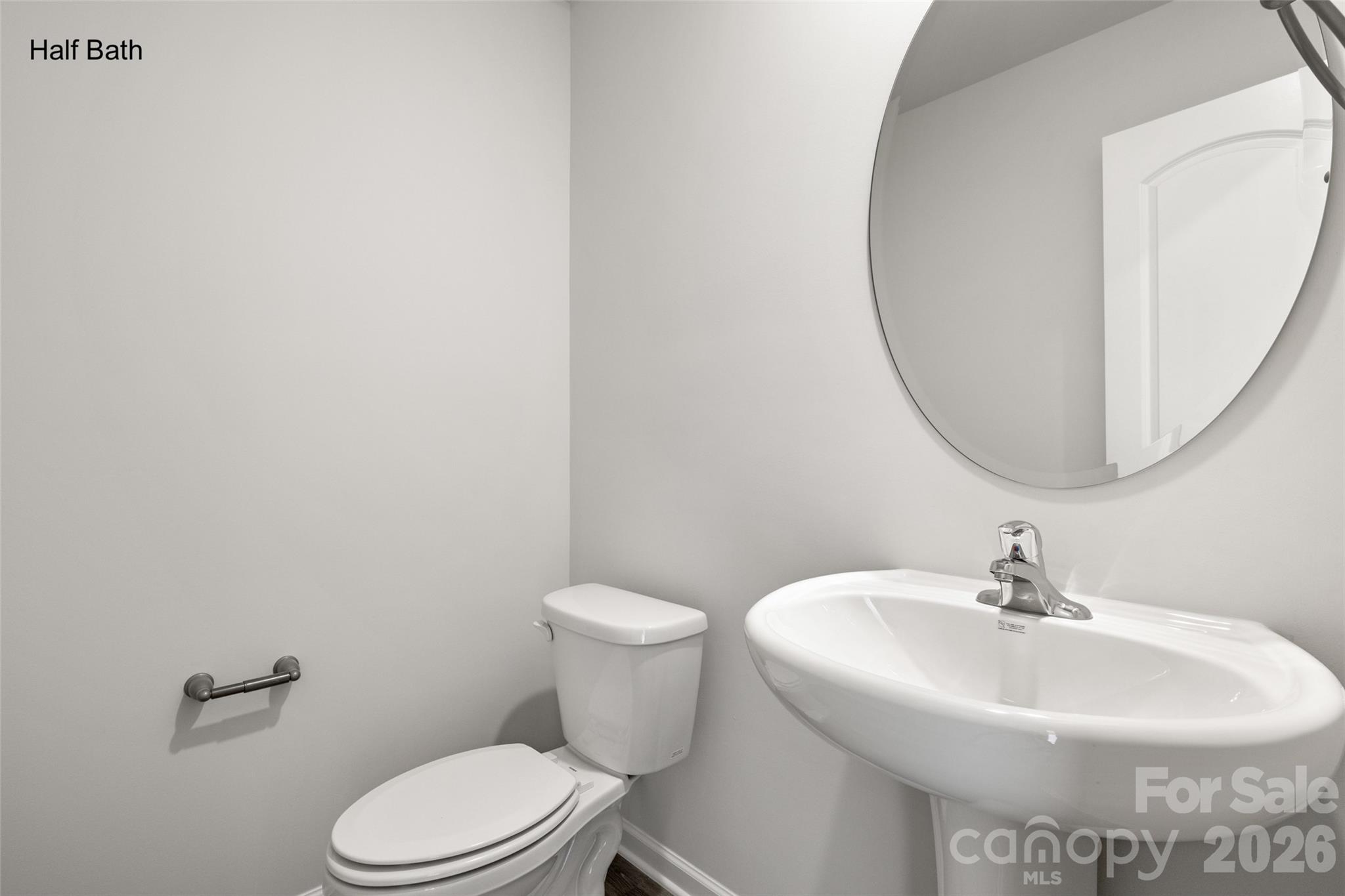 302 Elm Street Lancaster, SC 29720 - Photo 14 of 25 a white toilet sitting next to a bathroom sink