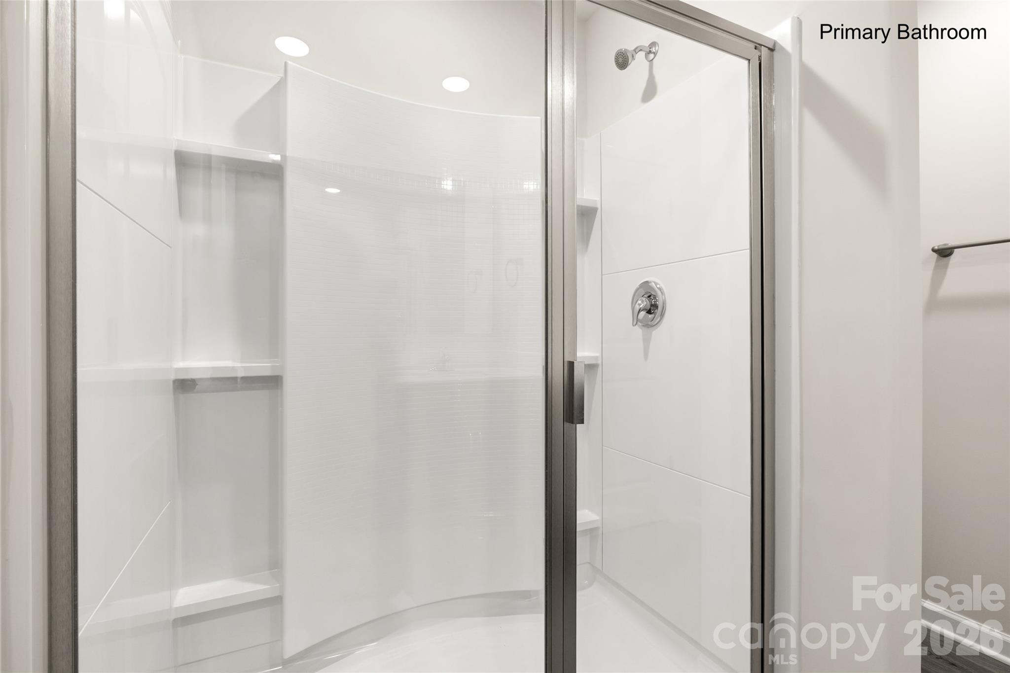 302 Elm Street Lancaster, SC 29720 - Photo 18 of 25 a bathroom with a shower and a glass door