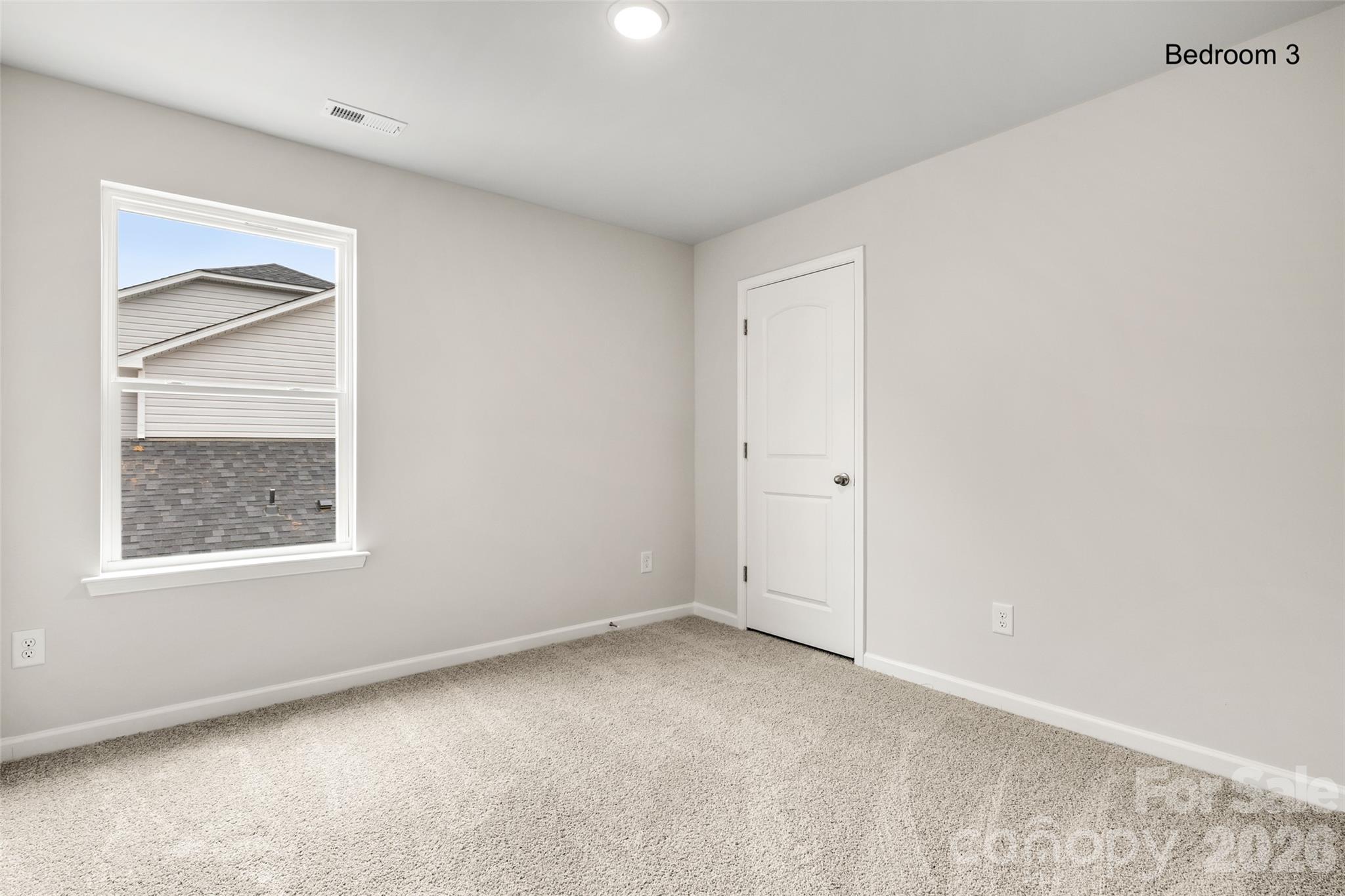 302 Elm Street Lancaster, SC 29720 - Photo 22 of 25 an empty room with windows and closet