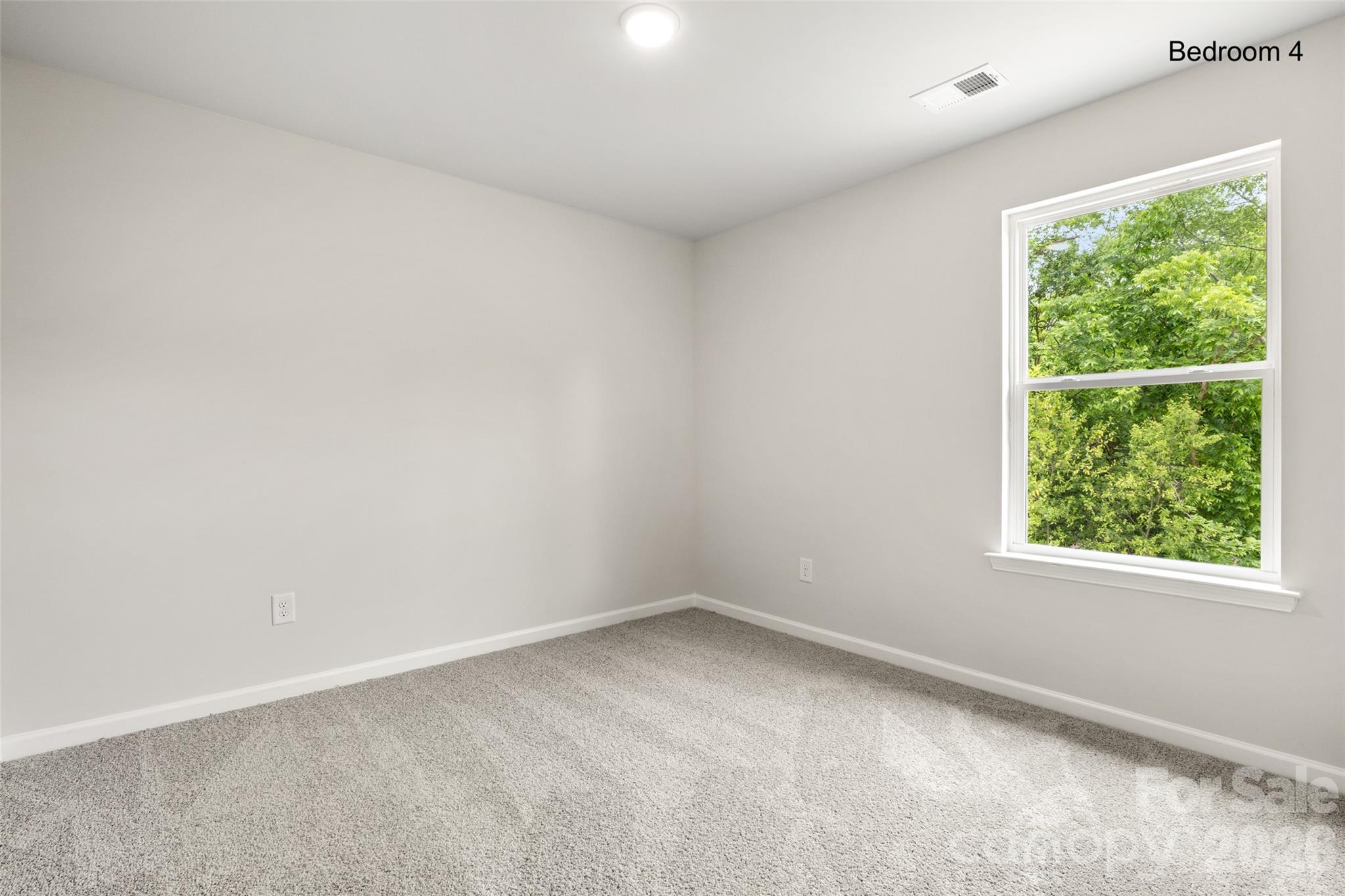 302 Elm Street Lancaster, SC 29720 - Photo 23 of 25 an empty room with a window