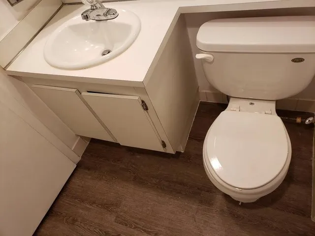 a bathroom with a toilet and a sink
