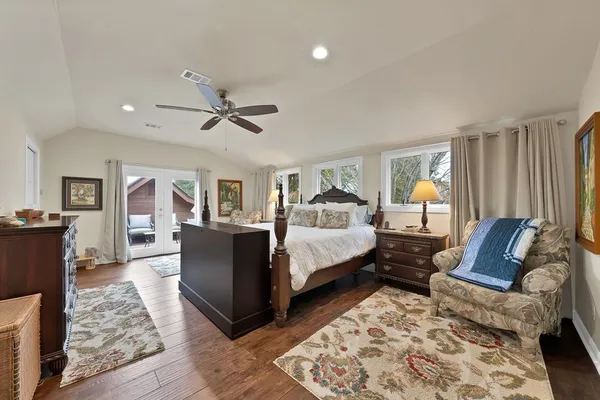 a bed room with furniture and a rug