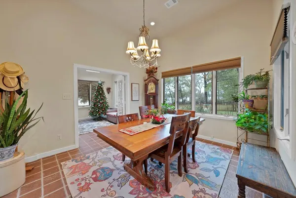 a outdoor dining room with furniture window and wooden floor