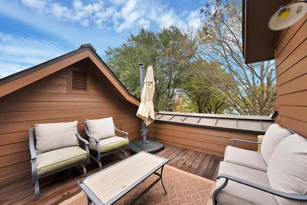 a view of sitting area with furniture and wooden fence