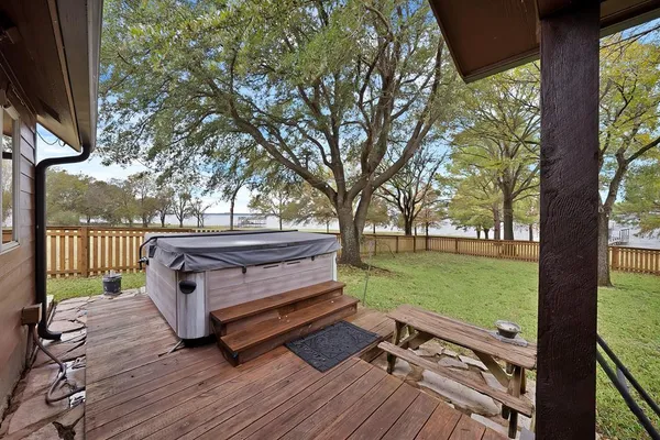 a view of a yard with wooden floor and outdoor seating