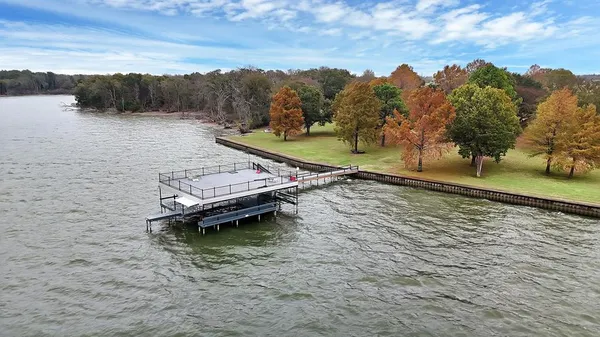 a view of a lake with outdoor space and sitting area