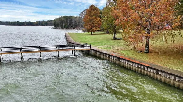 a view of a lake with a yard