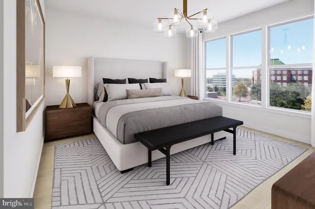 a dining room with furniture a chandelier and window