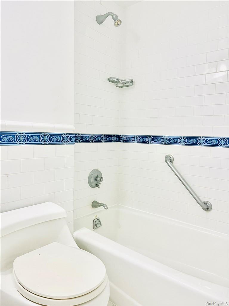 4901 Henry Hudson Parkway West, Unit 9F Bronx, NY 10471 - Photo 13 of 17 a bathroom with a toilet and a shower