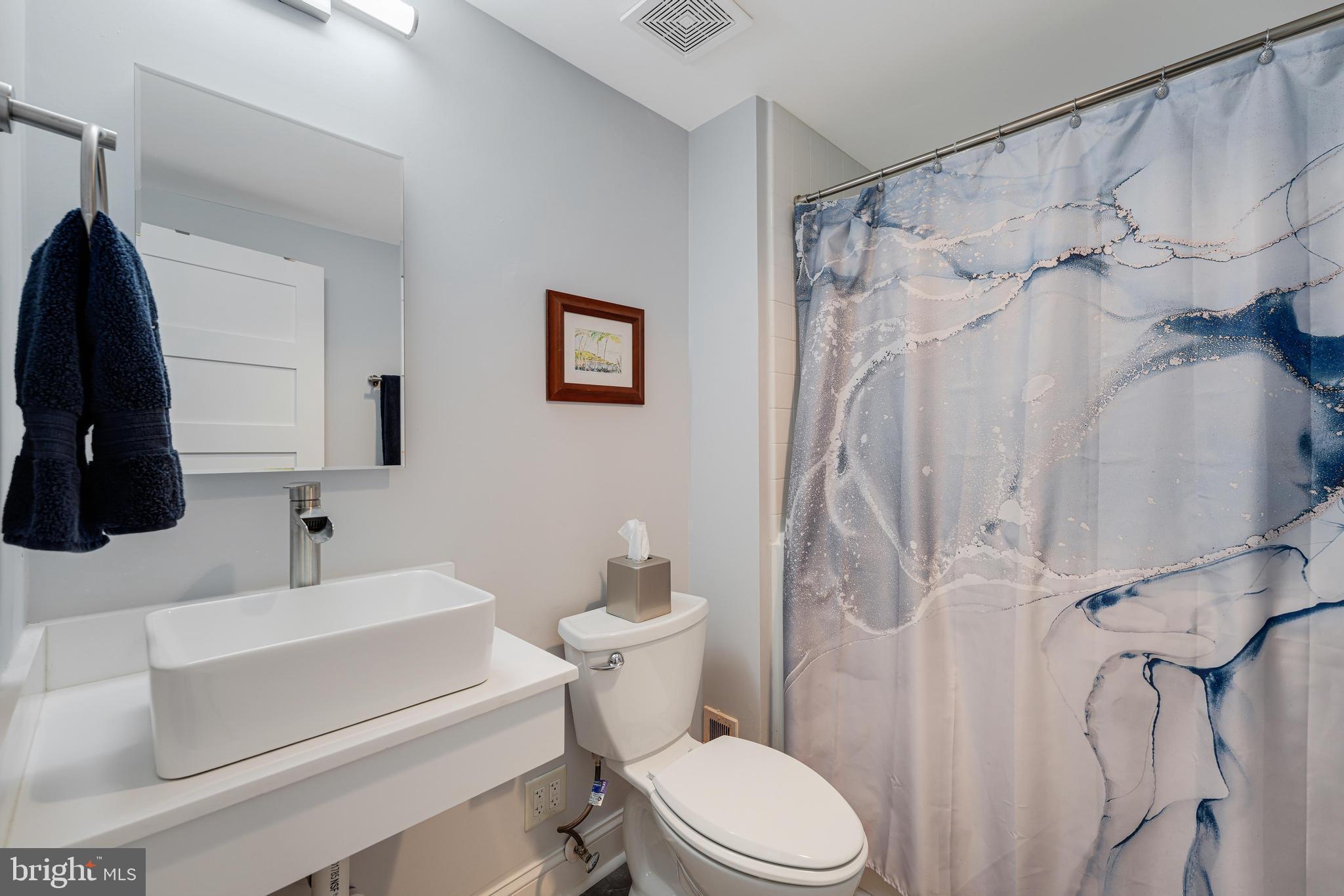 11434 Waterview Cluster Reston, VA 20190 - Photo 33 of 63 a bathroom with a sink toilet and shower