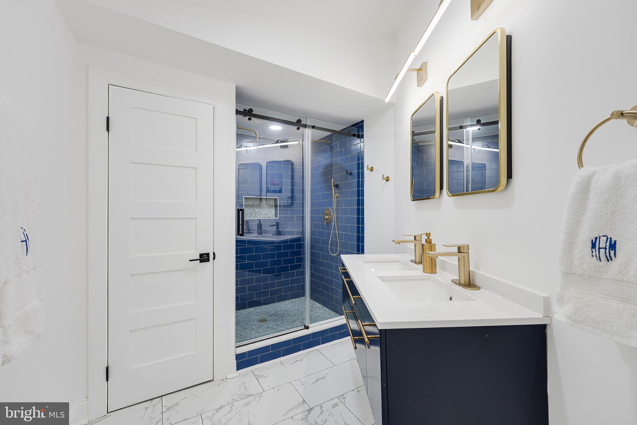 11434 Waterview Cluster Reston, VA 20190 - Photo 46 of 63 a bathroom with a sink and mirror