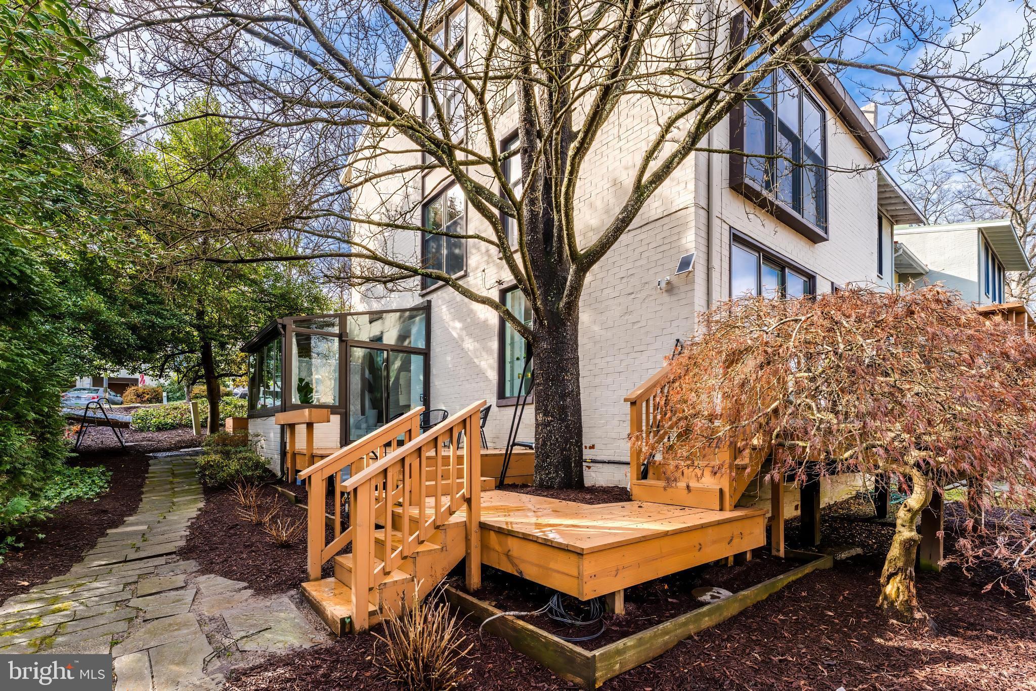 11434 Waterview Cluster Reston, VA 20190 - Photo 54 of 63 a wooden bench sitting in front of a building