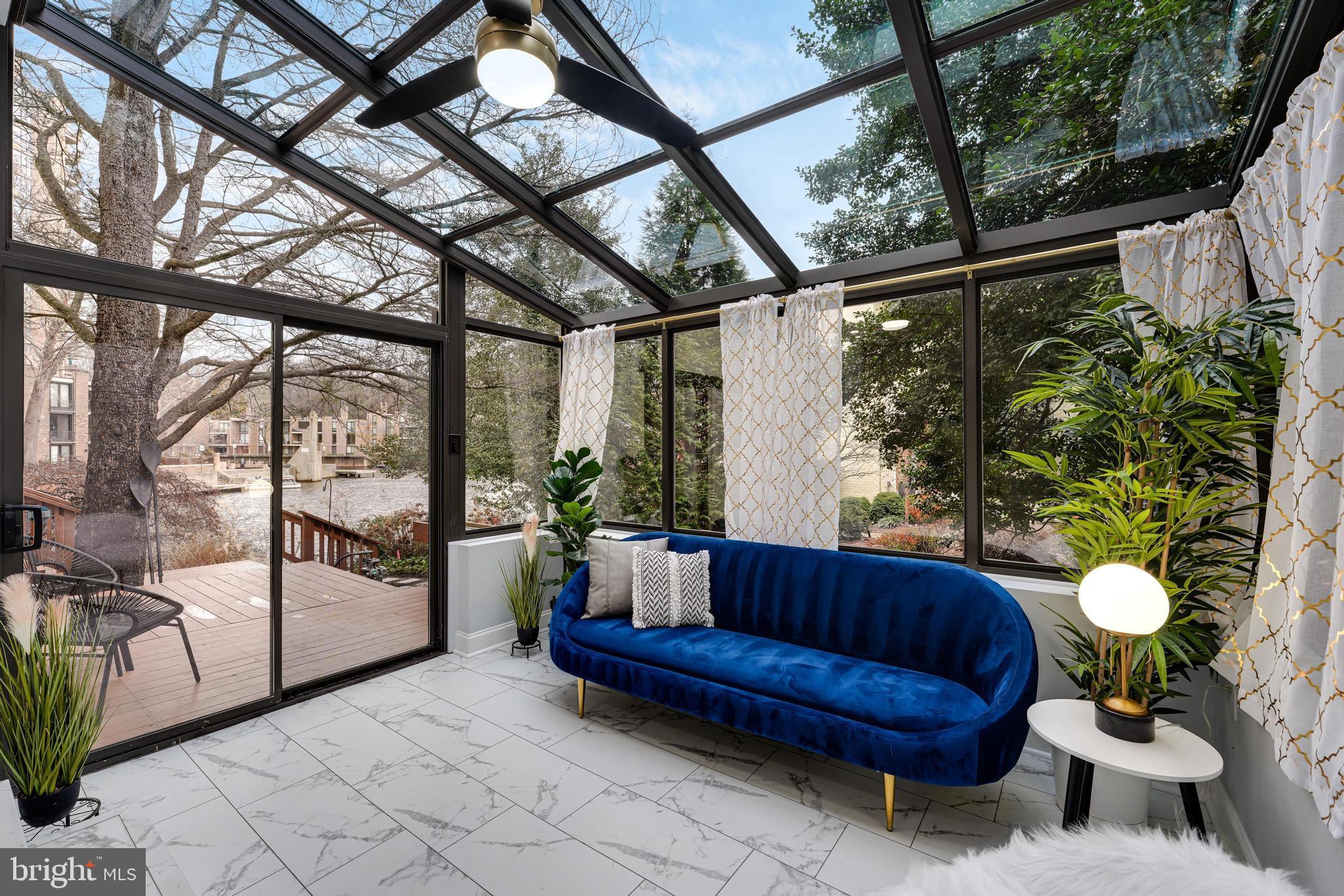 11434 Waterview Cluster Reston, VA 20190 - Photo 10 of 63 a view of a porch with furniture and a potted plant