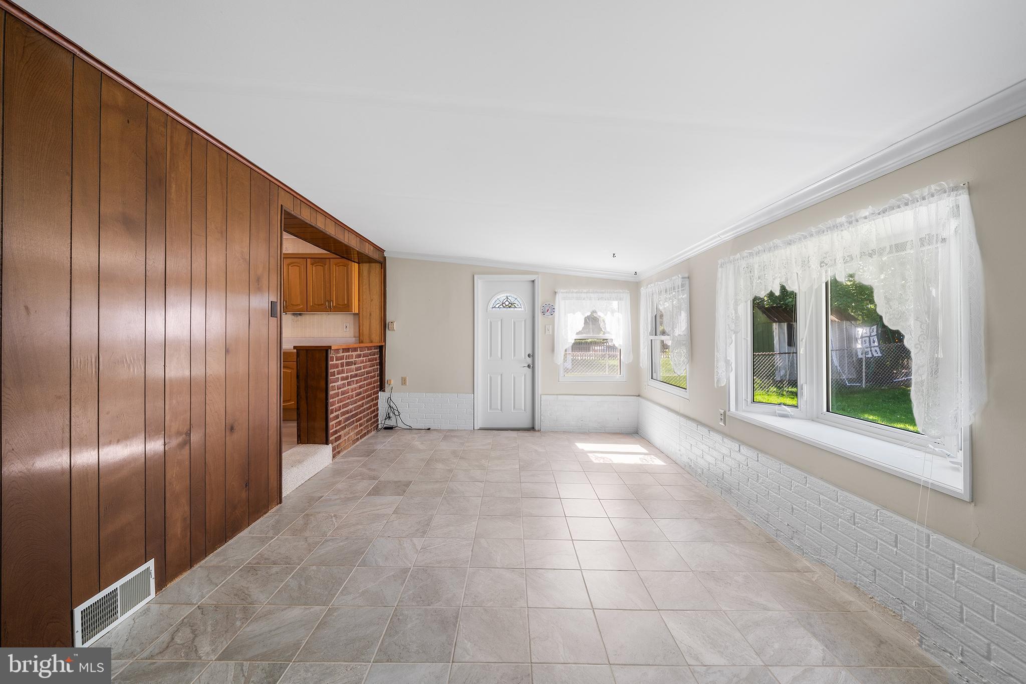 504 Lawrence Road Havertown, PA 19083 - Photo 15 of 20 a view of an empty room with window and cabinet