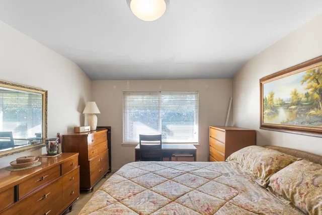 a kitchen with stainless steel appliances a refrigerator and a stove top oven