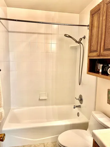 an aerial view of multiple houses with yard