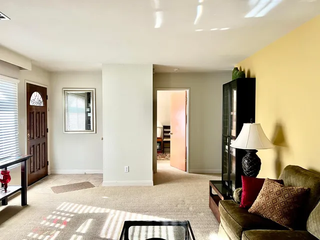a kitchen that has a sink and a stove in it