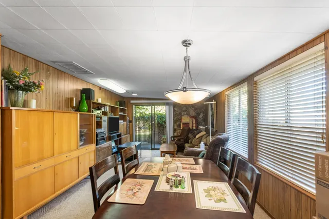 a view of a table and chairs under an umbrella in patio