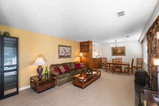 a kitchen with a sink a counter top space and cabinets