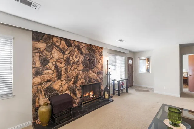 a dining room with furniture and a fireplace