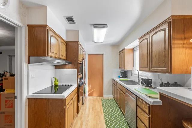 a bedroom with a bed and a painting on the wall