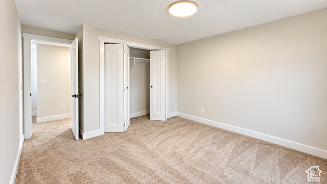 342 East 600 North Logan, UT 84321 - Photo 6 of 19 Neutral-toned carpeting, white trim, and a flush-mount ceiling light