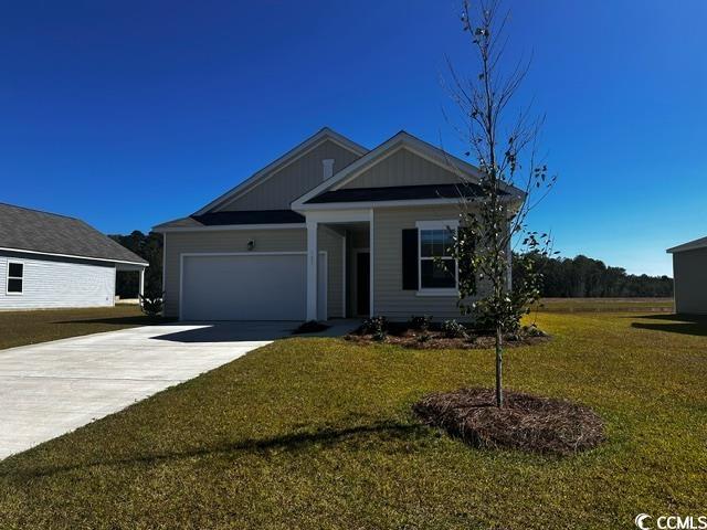 147 Linares Street Loris, SC 29569 - Photo 1 of 17 View of front facade featuring a front yard and a