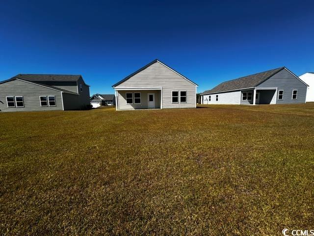 147 Linares Street Loris, SC 29569 - Photo 16 of 17 Rear view of property with a yard