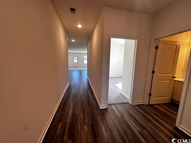 147 Linares Street Loris, SC 29569 - Photo 2 of 17 Hall with dark wood-type flooring
