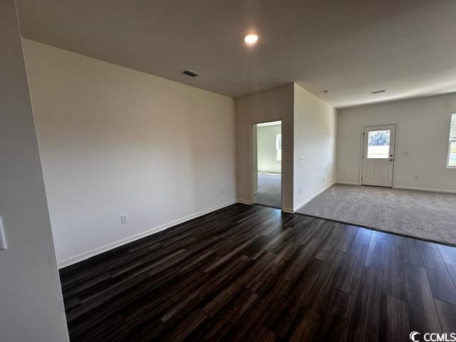 147 Linares Street Loris, SC 29569 - Photo 9 of 17 Spare room with dark hardwood / wood-style floorin
