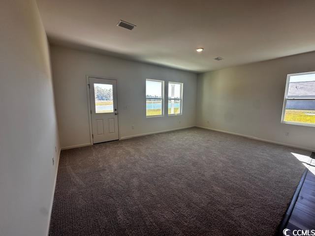 147 Linares Street Loris, SC 29569 - Photo 10 of 17 Unfurnished room with dark carpet