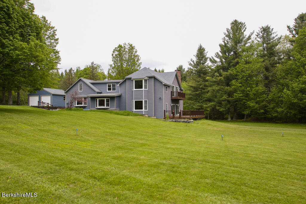 1271 Main Road Savoy, MA 01256 - Photo 4 of 38 a front view of house with an outdoor space and seating