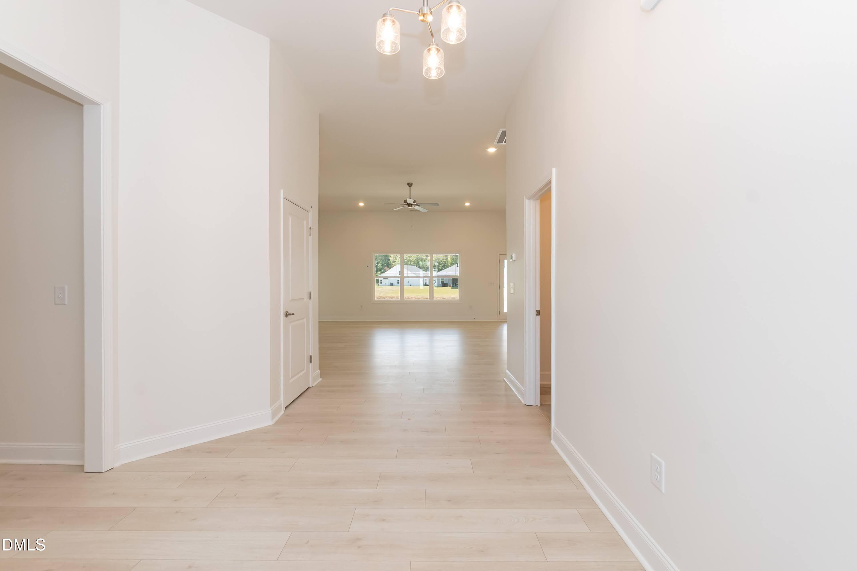 254 Galway Road Lillington, NC 27546 - Photo 5 of 35 a view of a hallway with wooden floor