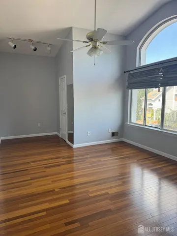 a kitchen with kitchen island granite countertop a stove cabinets and microwave