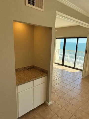 a view of an empty room and window