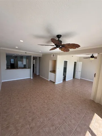 a view of a livingroom with a kitchen