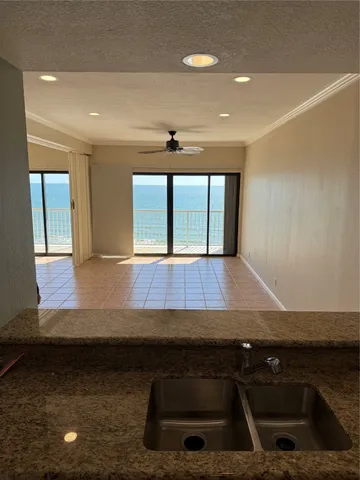 a view of kitchen with furniture and window